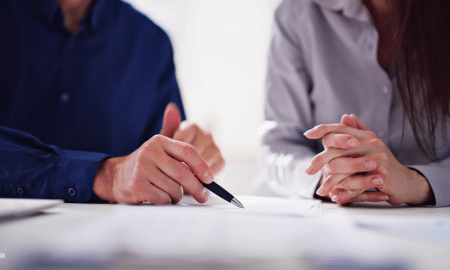 People signing a contract